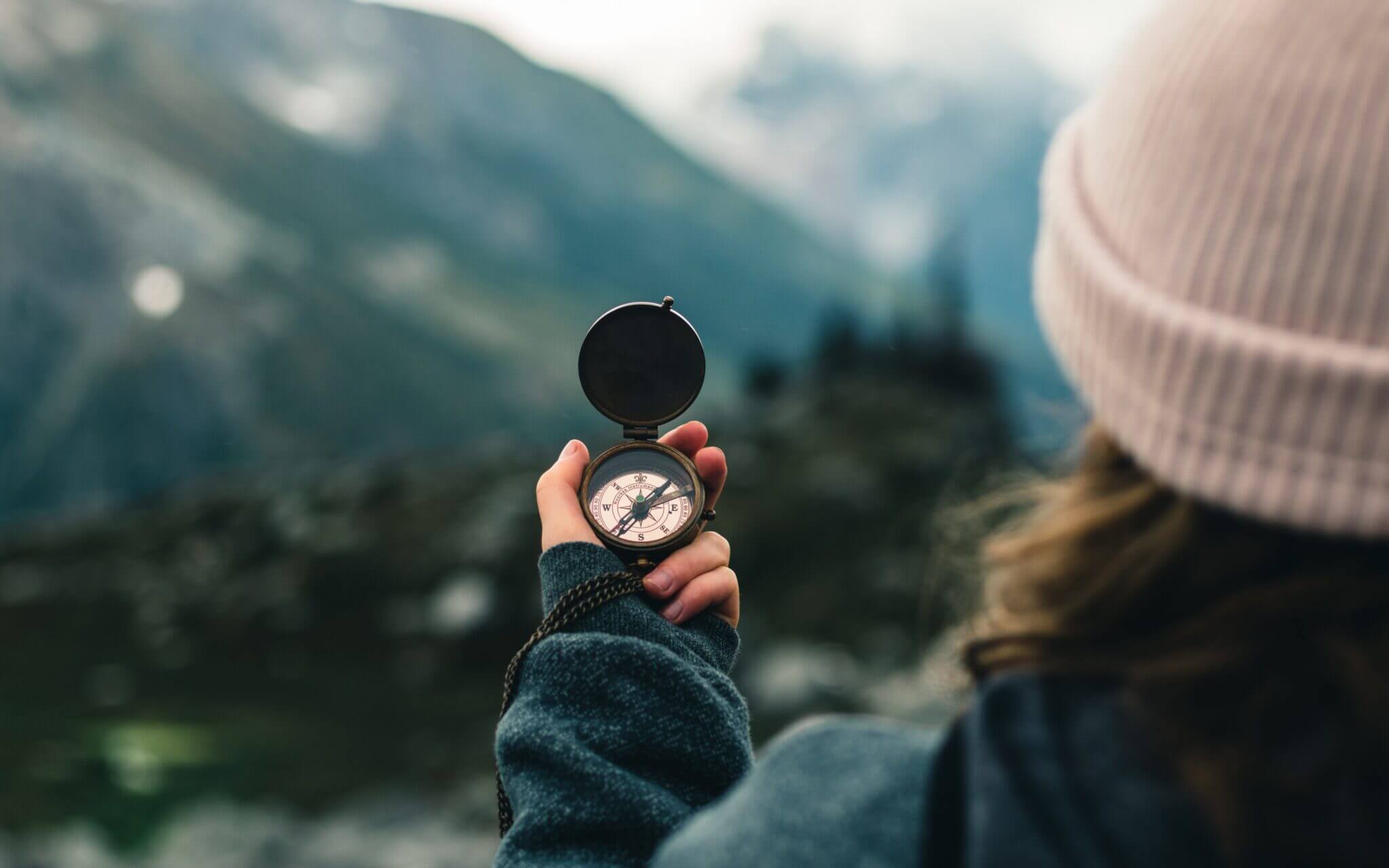 woman holding a compass